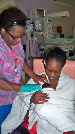 Nurse Faye John-Baptiste helps Lakeisha Iles hold baby Liniyah for the first time. Nurse Faye John-Baptiste helps Lakeisha Iles hold baby Liniyah for the first time.
